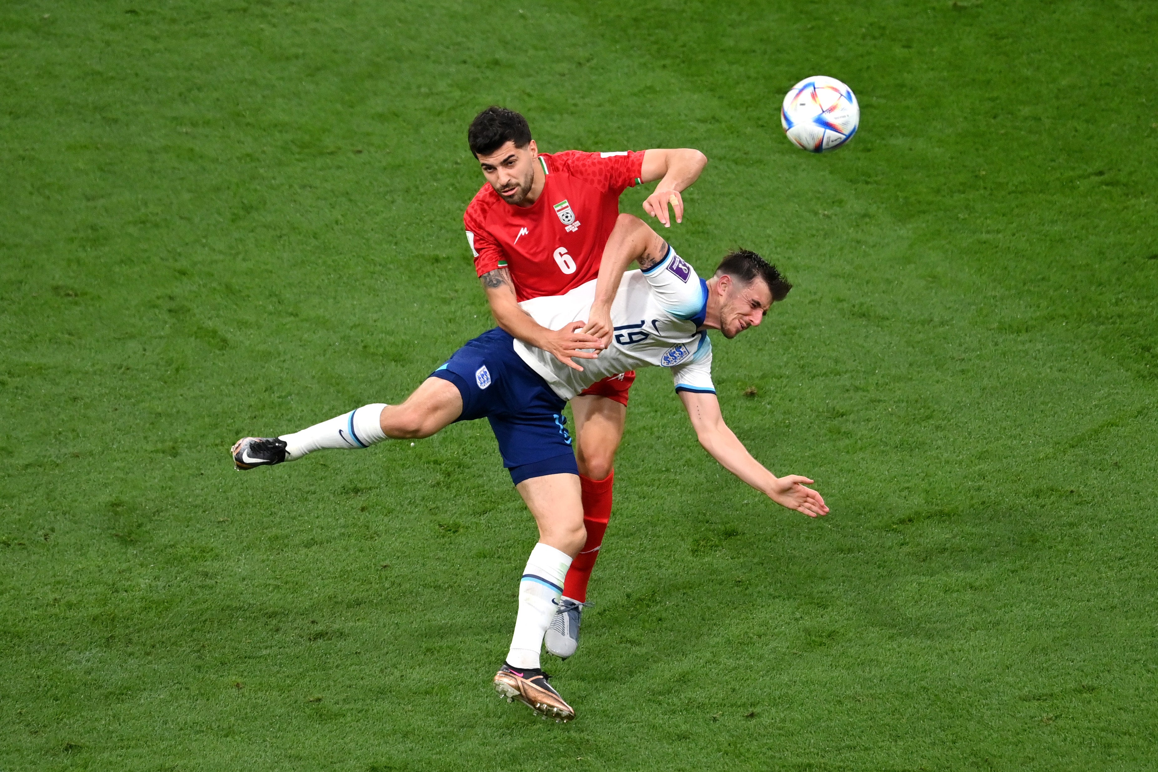 Mason Mount competes for a header with Saeid Ezatolahi