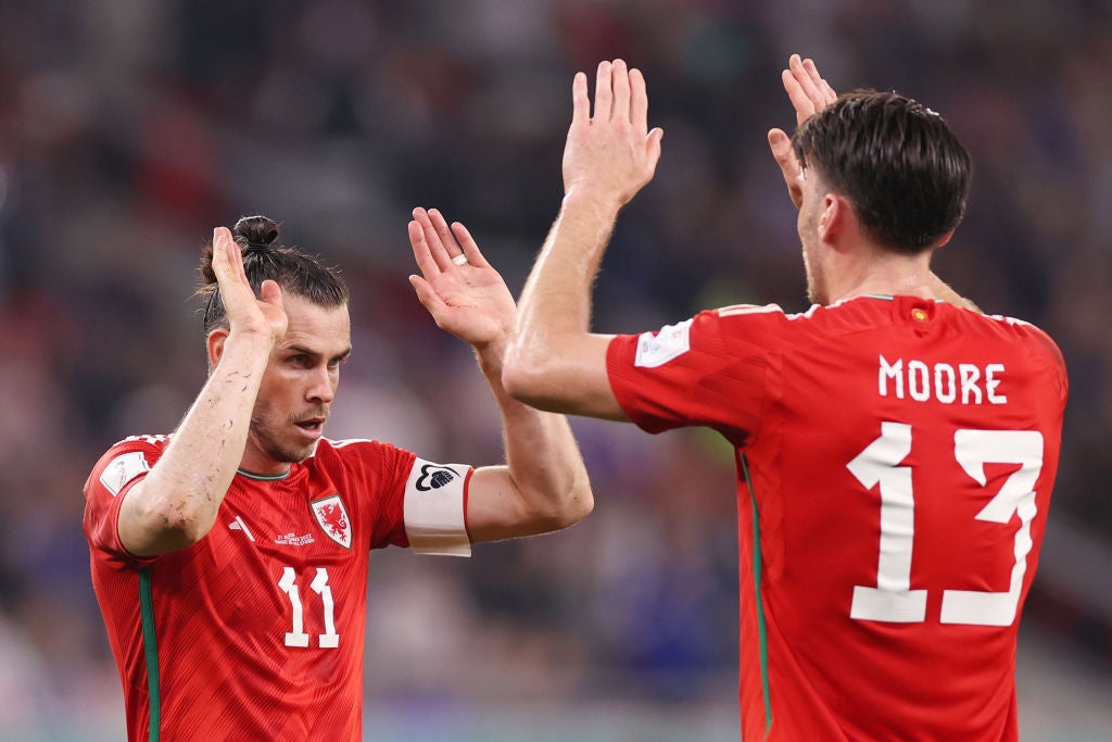 Gareth Bale and Kieffer Moore celebrate the Welsh comeback that gives them their first point in Qatar