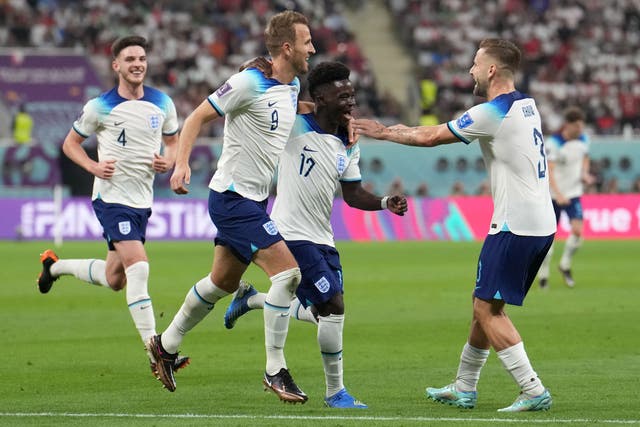 Bukayo Saka (centre) netted a brace for England against Iran (Martin Rickett/PA)