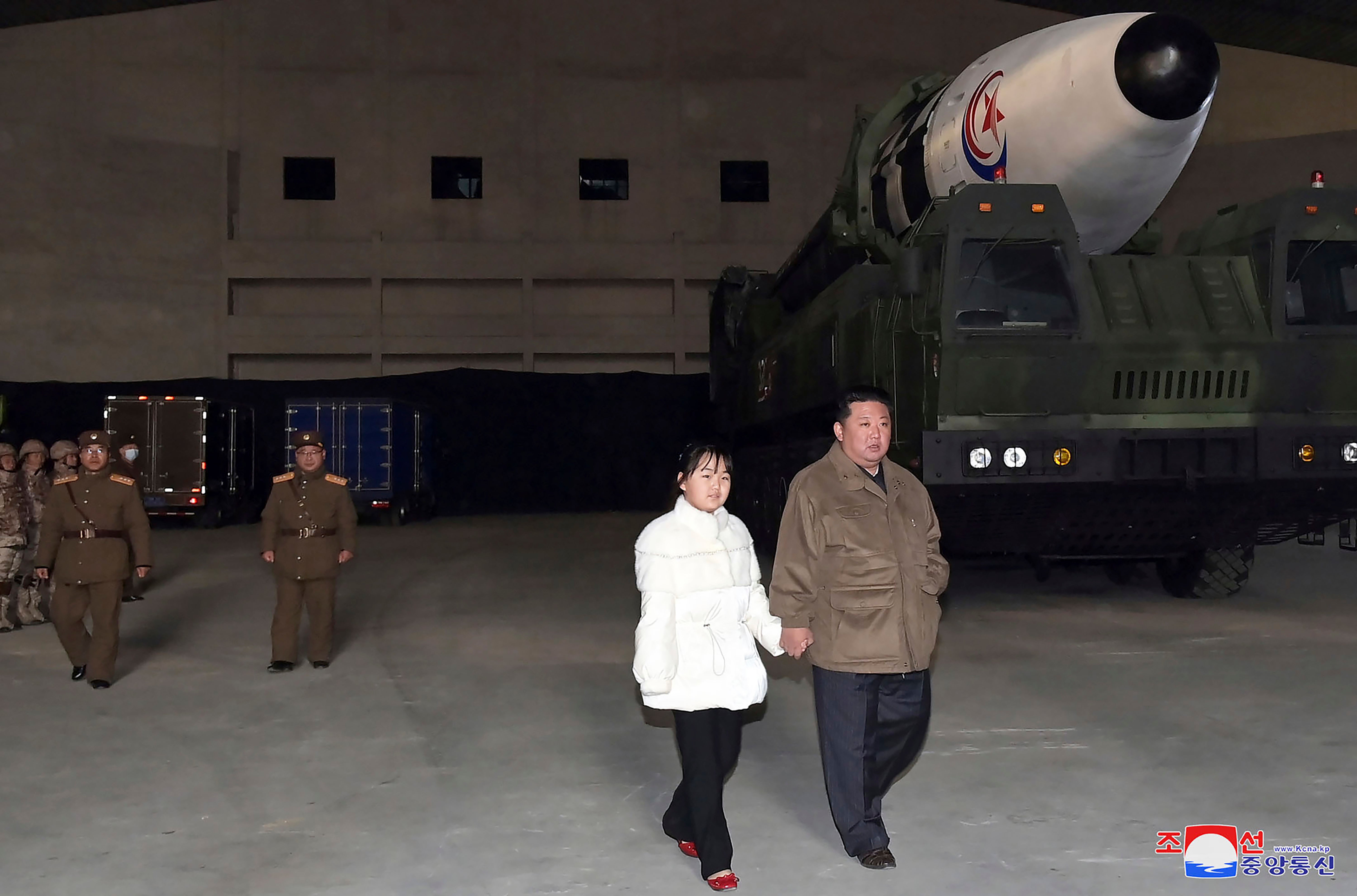 North Korean leader Kim Jong-un, right, and his daughter inspect a missile at Pyongyang International Airport