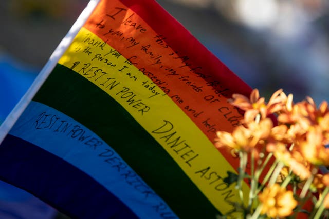 <p>A flag with a message to  victims of the mass shooting at Club Q sits at a memorial outside in Colorado Springs </p>