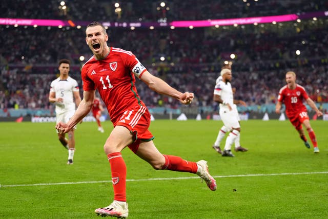 Gareth Bale celebrates scoring Wales’ first goal at a World Cup for 64 years (Nick Potts/PA)
