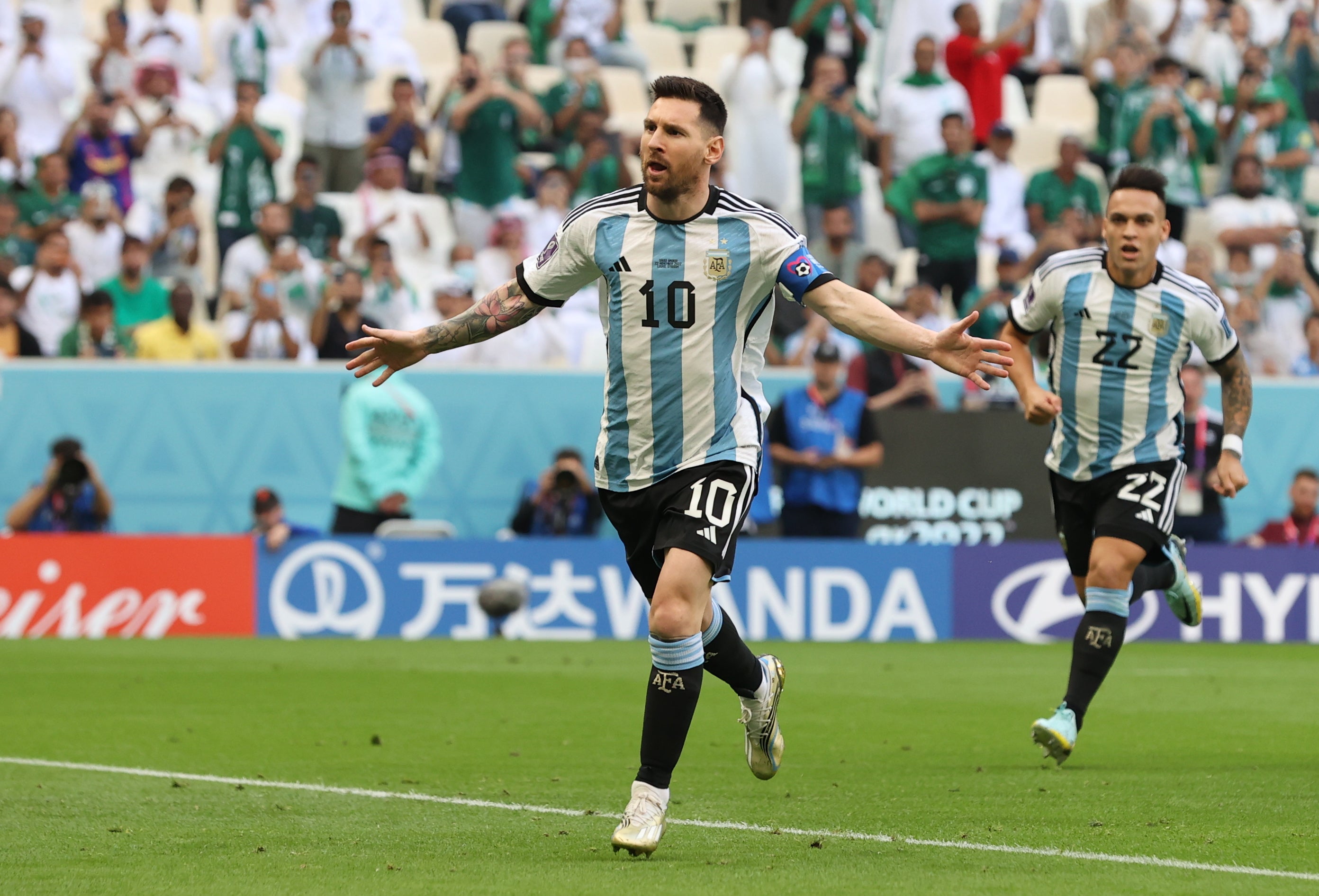 Lionel Messi celebrates after scoring a penalty to hand Argentina the lead