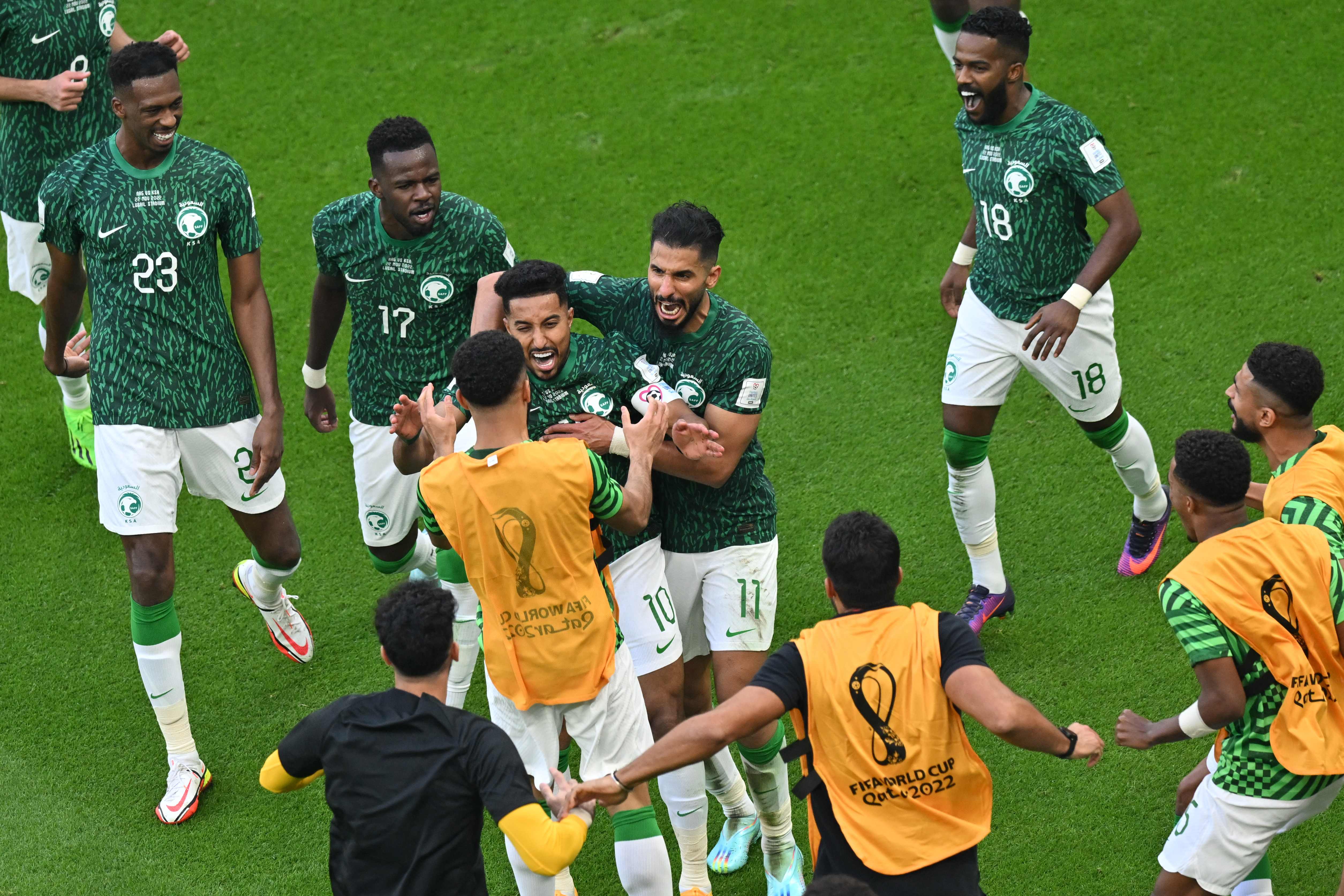 Al Dawsari celebrates with his teammates
