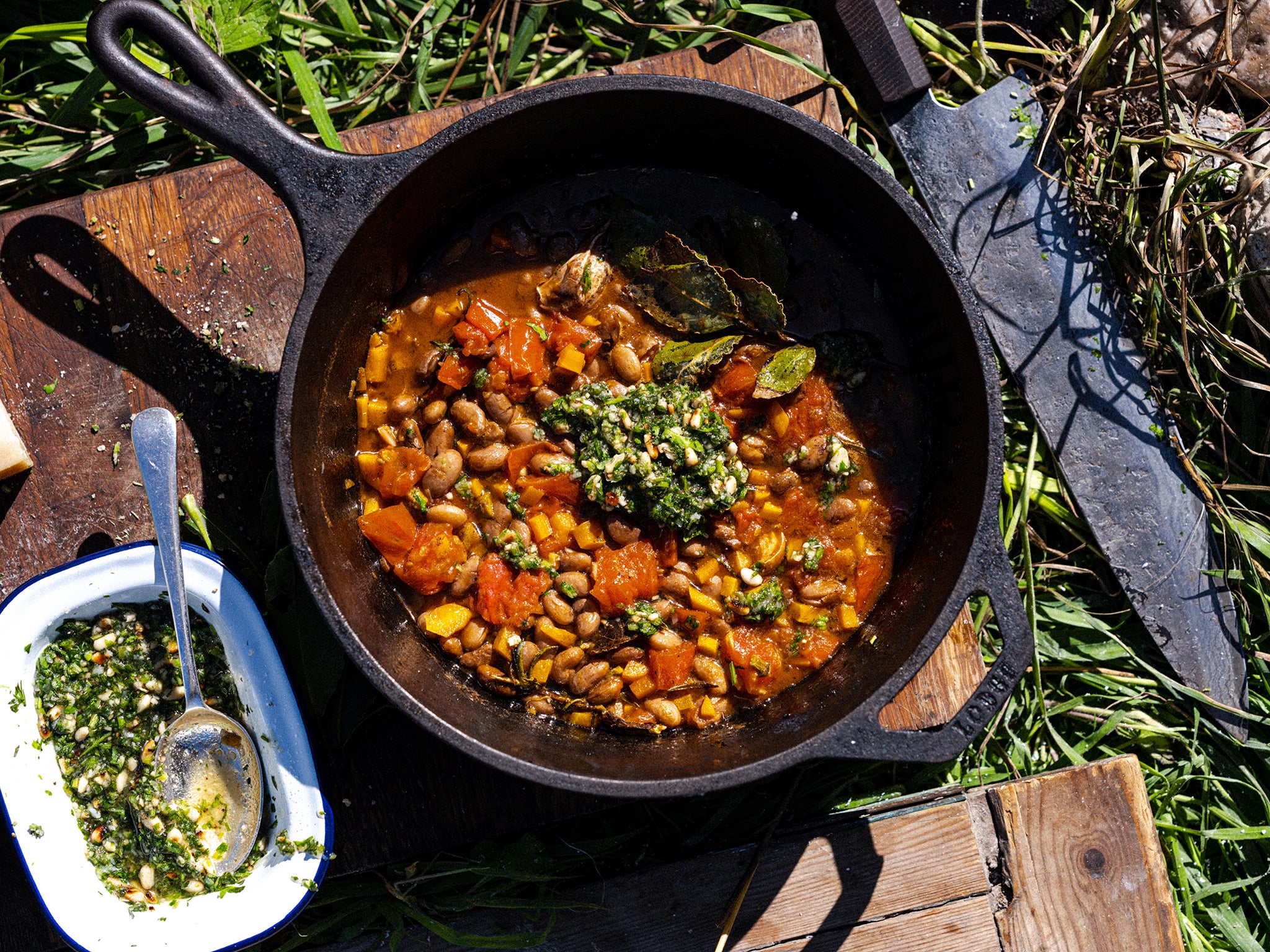 Carrot top pesto boosts the flavour of this borlotti bean stew, while also saving waste