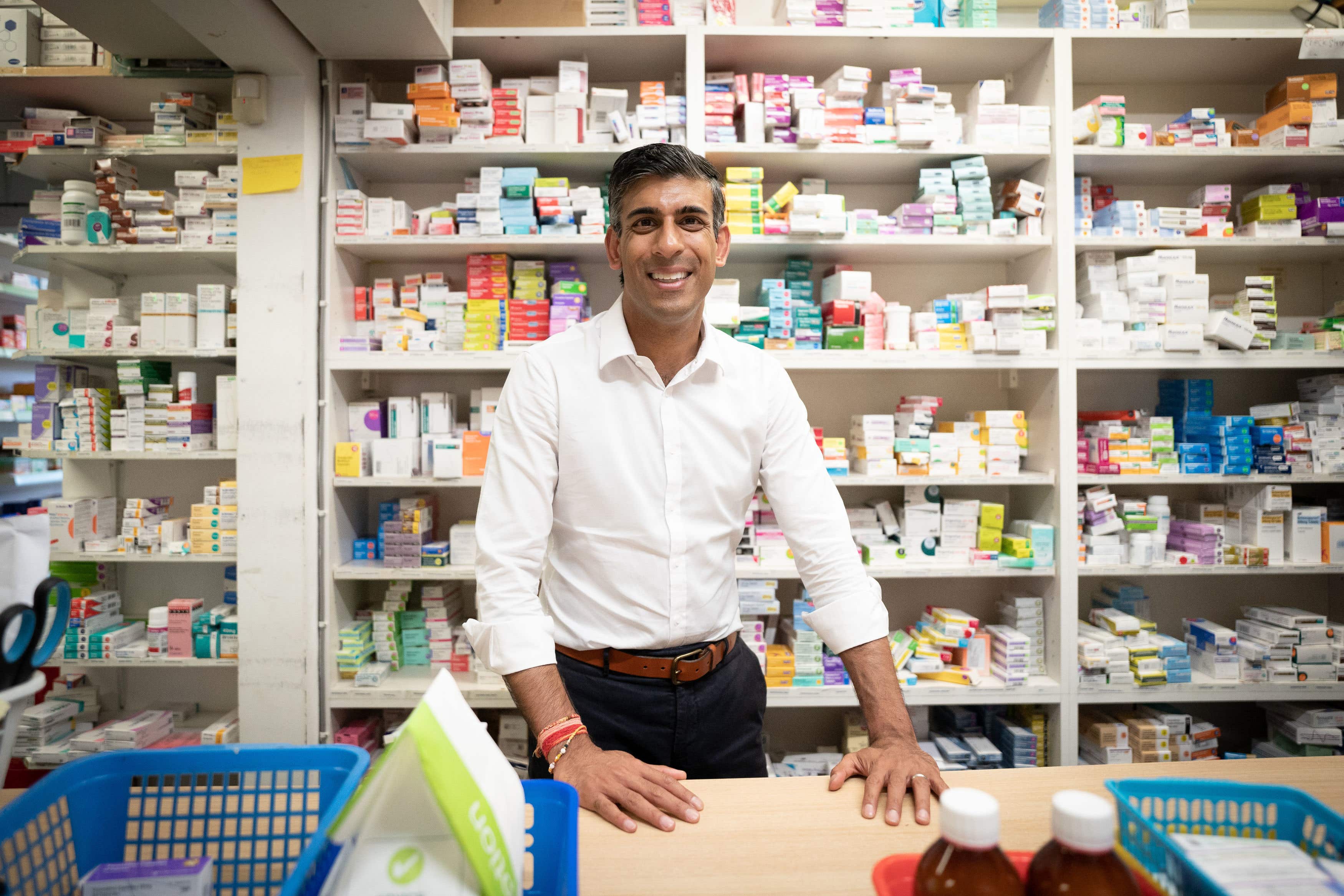 Rishi Sunak during a visit to his family’s old business, Bassett Pharmacy, in Southampton, Hampshire, as part of his leadership campaign in the summer (Stefan Rousseau/PA)