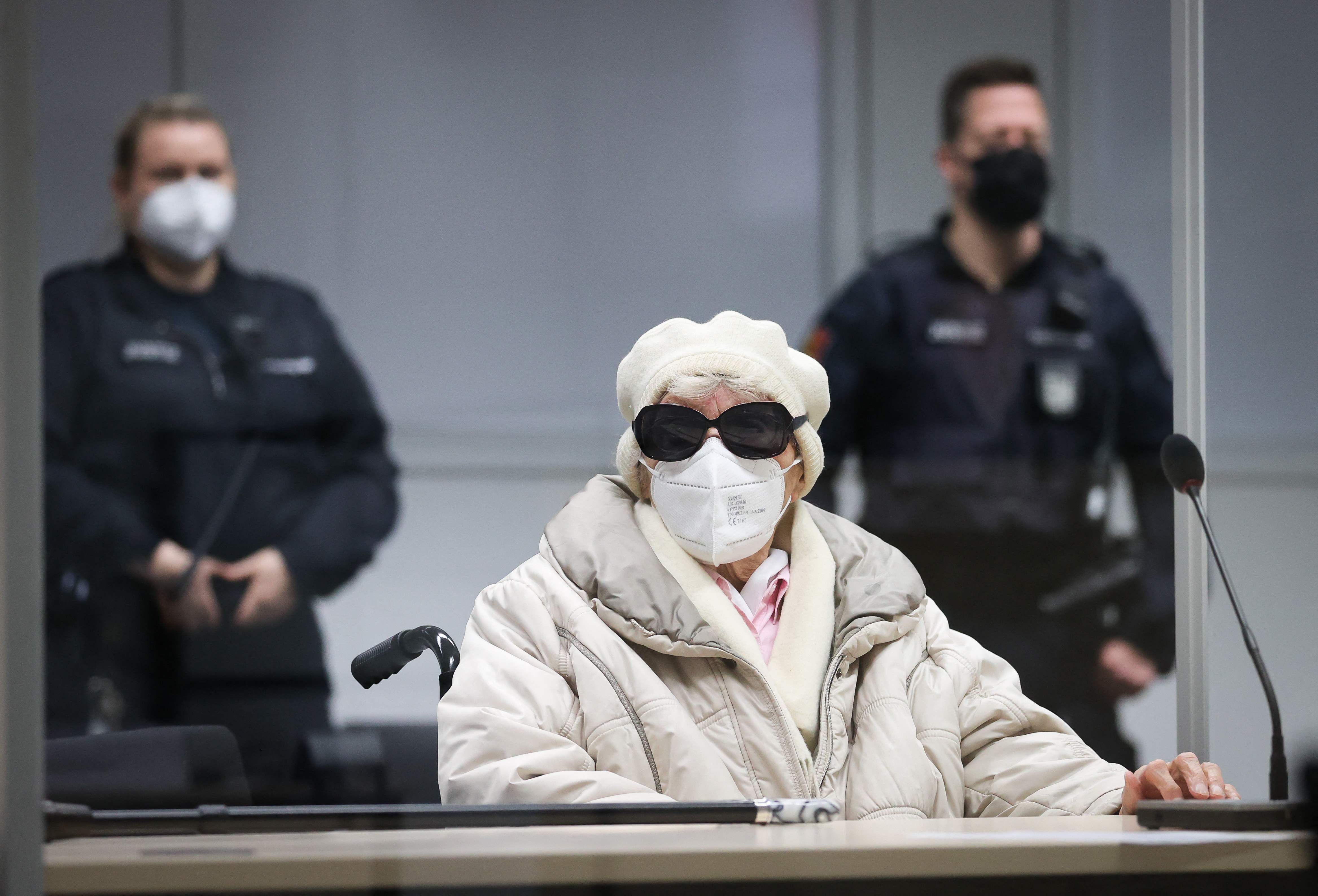 Defendant Irmgard F., a former secretary for the SS commander of the Stutthof concentration camp, wears sunglasses and a face mask as she waits for the continuation of her trial at the court in Itzehoe