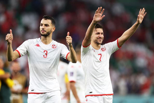 <p>Montassar Talbi and Youssef Msakni of Tunisia applaud fans after draw </p>