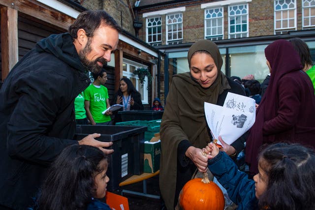 <p>Lord Lebedev distributes food to families at St Paul’s Primary School in Whitechapel, east London</p>