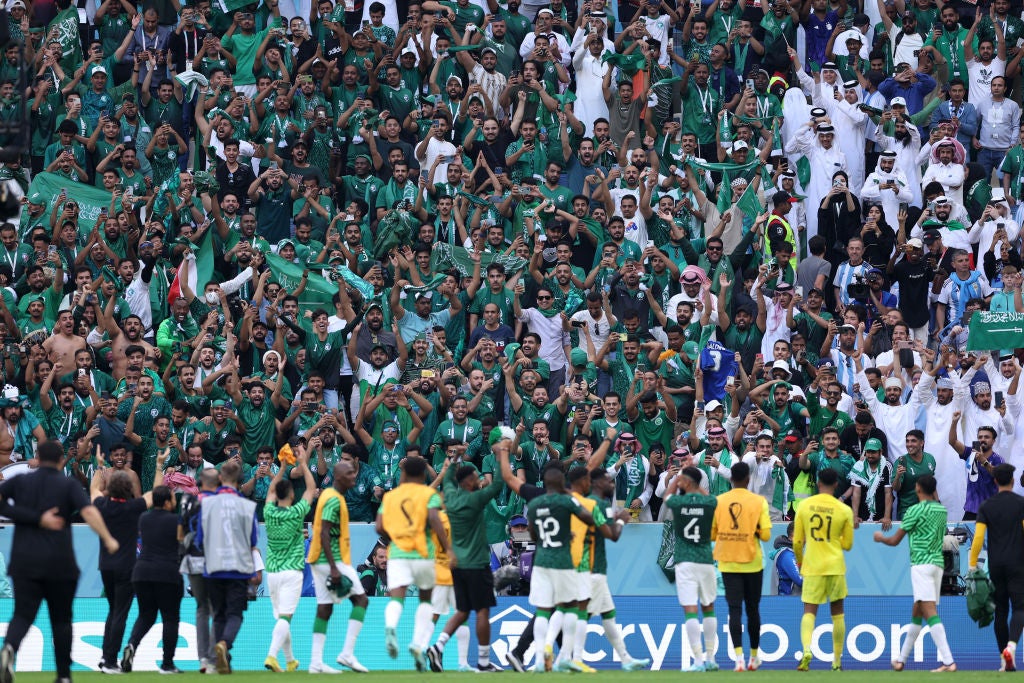 Saudi Arabia’s players celebrate with their fans at the Lusail Stadium