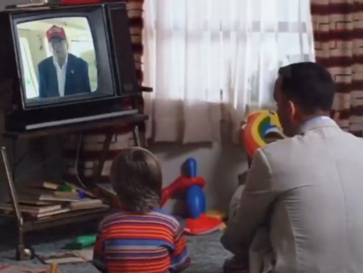 A shot from an edited video showing characters from the film Forrest Gump watching former President Donald Trump on television