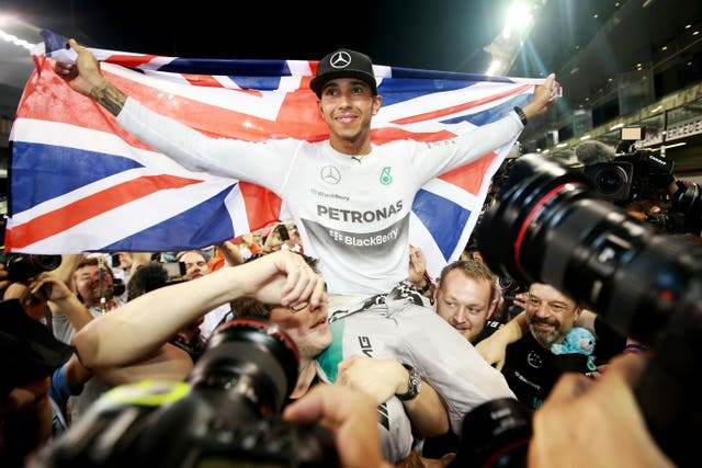 Mercedes driver Lewis Hamilton celebrates becoming World Champion for the second time after victory in the 2014 Abu Dhabi Grand Prix (David Davies/PA)