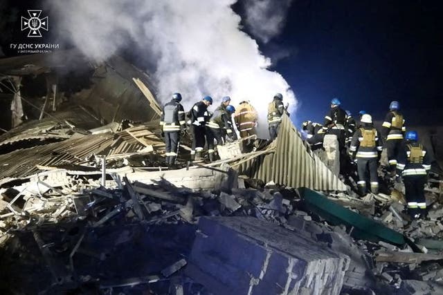 <p>Rescuers work at the site of a maternity ward of a hospital destroyed by a Russian missile attack</p>