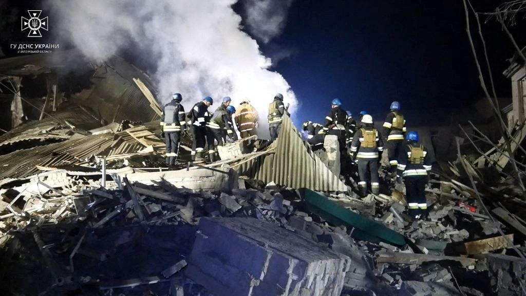 Rescuers work at the site of a maternity ward of a hospital destroyed by a Russian missile attack
