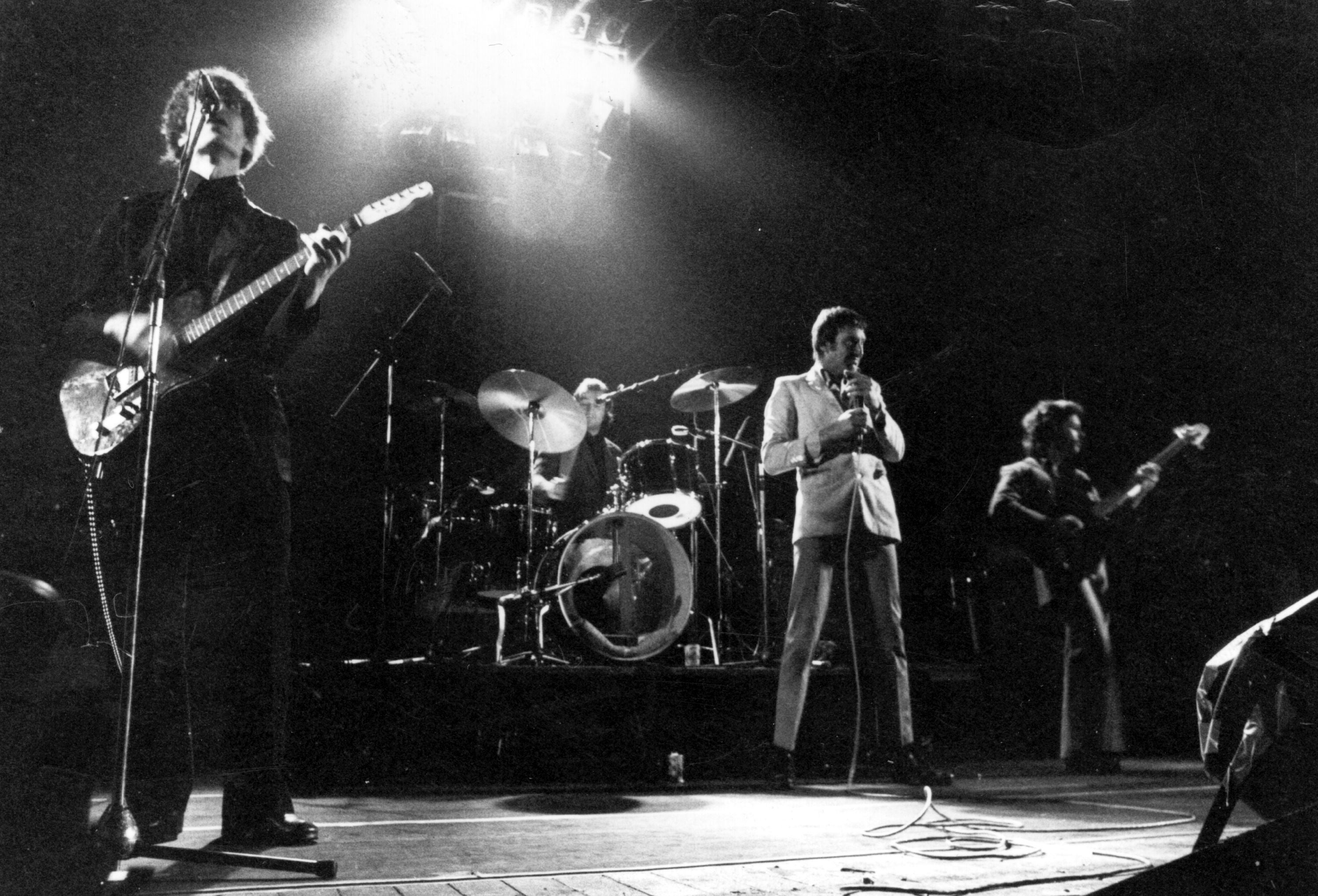 Johnson (left) on stage with Dr Feelgood in 1976