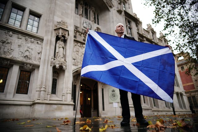 A Scottish independence supporter outside the UK Supreme Court (Aaron Chown/PA)