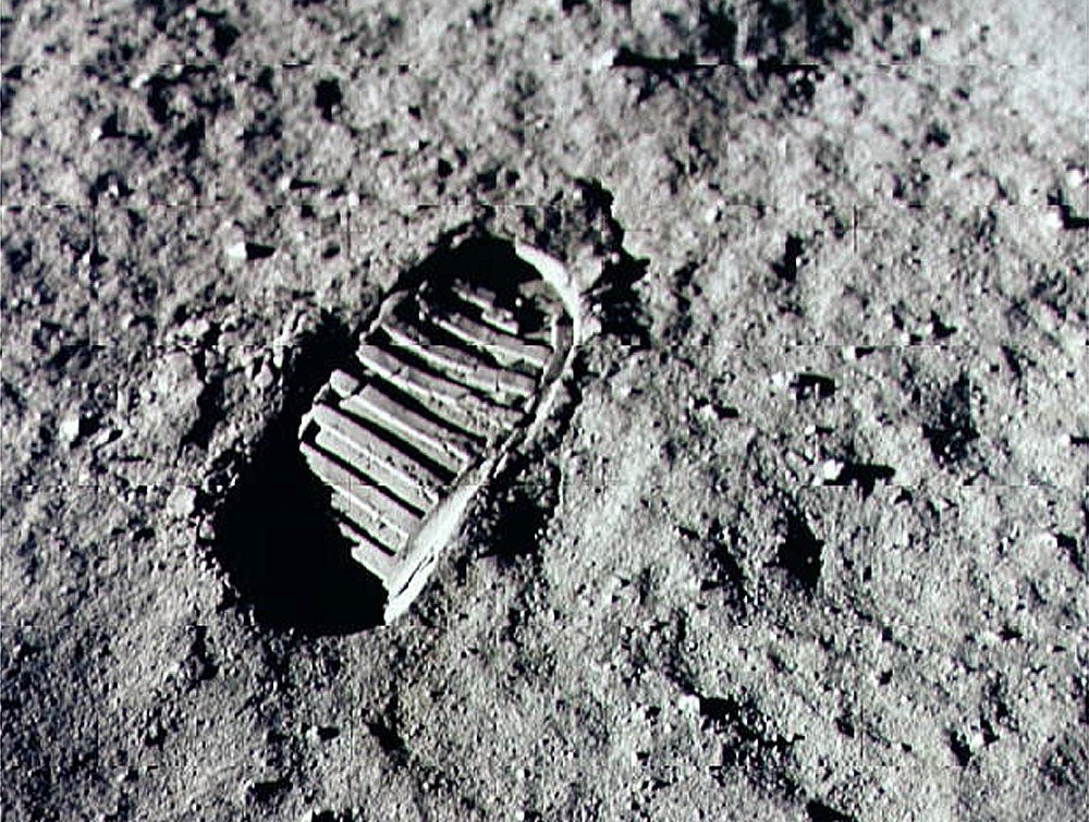 Neil Armstrong steps into history in 1969 by leaving the first human footprint on the surface of the moon