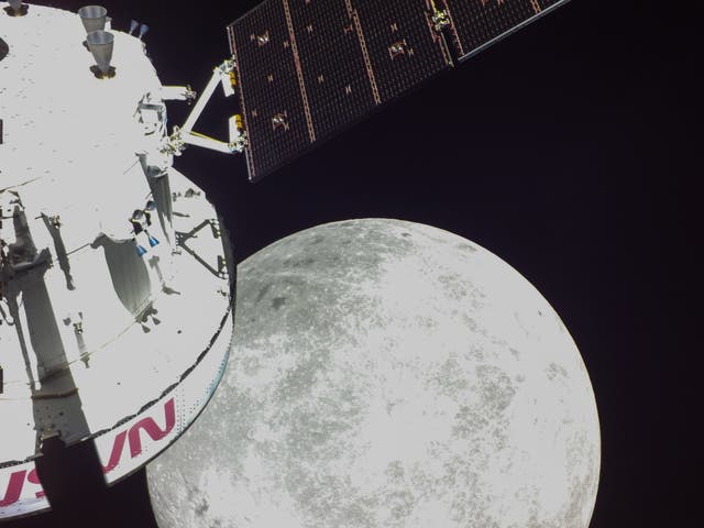 <p>Handout photo made available by the NASA shows a portion of the far side of the Moon looms large just beyond the Orion spacecraft in this image taken on the sixth day of the Artemis I mission by a camera on the tip of one of Orion’s solar arrays</p>