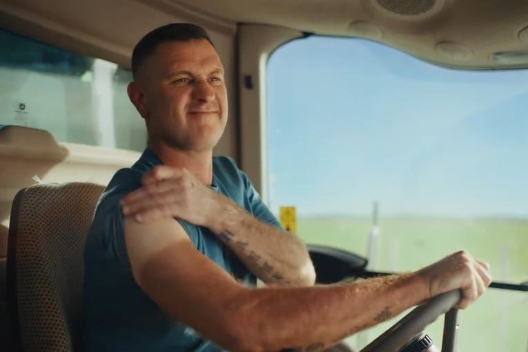 Screengrab taken of the scene in the Waitrose Christmas advert 2022 that showed two farmers comparing sun tans. Waitrose has altered the section of the advert following criticism by a skin cancer charity and patients (Waitrose/PA)