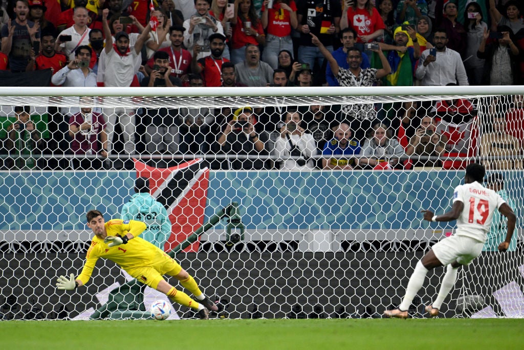 Thibaut Courtois dives to save Alphonso Davies’ penalty