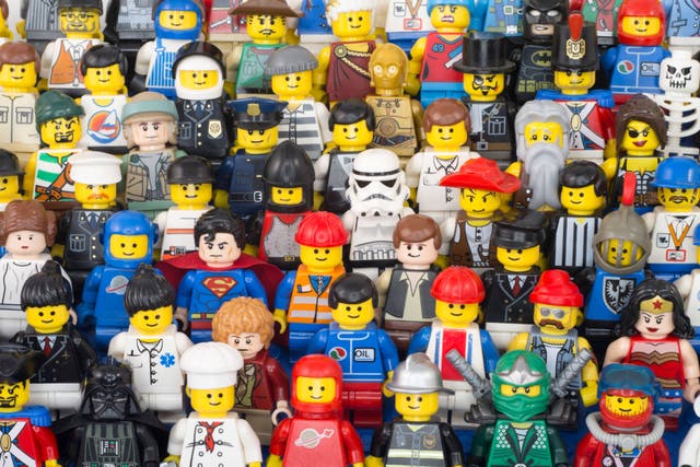 Lego minifigures both classic and modern versions from early 80’s spaceman to Stormtroopers and a Hobbit (Chris Willson/Alamy/PA)