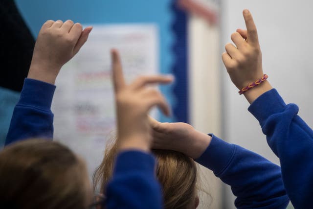 Disadvantaged pupils have fallen behind their peers in reading and maths skills, a study has found (Danny Lawson/PA)
