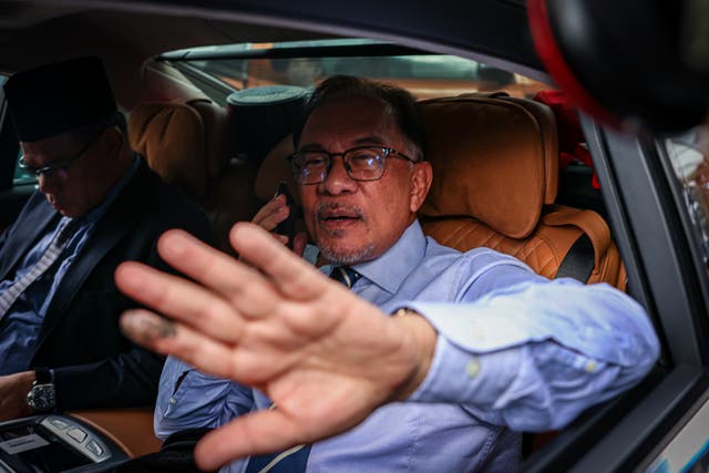 <p>Anwar Ibrahim, chairman of Pakatan Harapan (The Alliance of Hope) coalition, leaves his Bukit Gasing Office Residence, where he is expected to meet the King of Malaysia at the Istana Negara on 22 November 2022 in Petaling Jaya, Selangor, Malaysia</p>