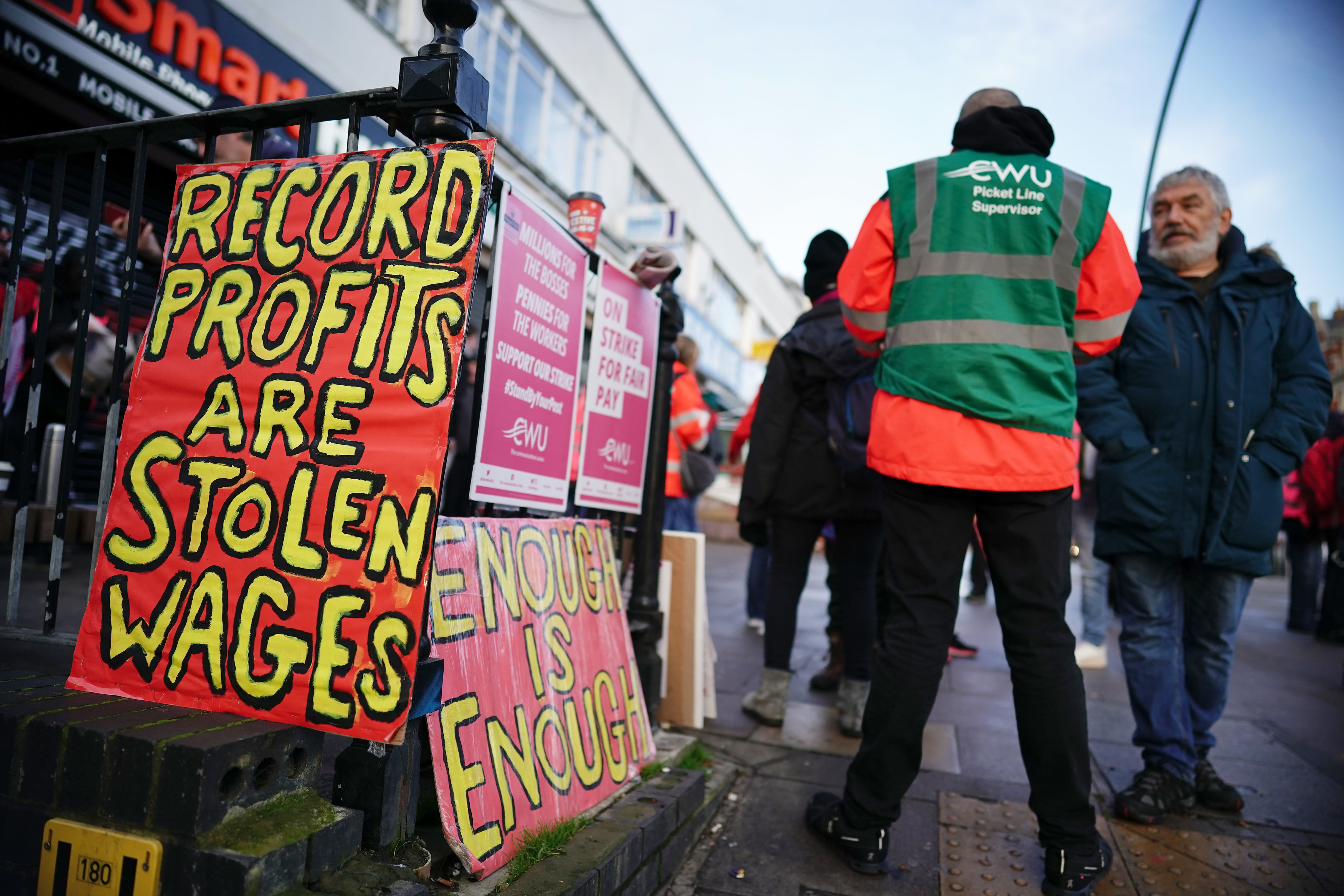 Postal workers on the picket line at the Kilburn Delivery Office in north west London. Members of the Communication Workers Union (CWU) are holding a 48-hour strike in a long-running dispute over jobs, pay and conditions (Aaron Chown/PA)