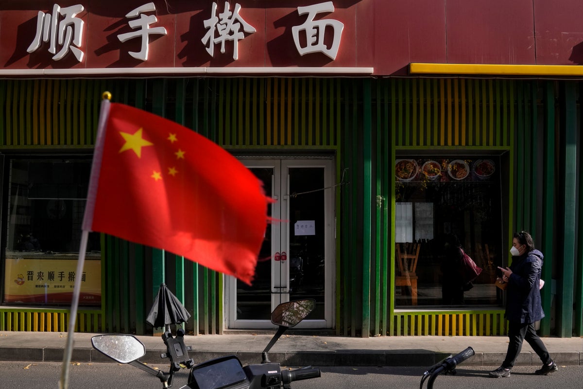 AP PHOTOS: Beijing life on hold for lockdowns, COVID testing