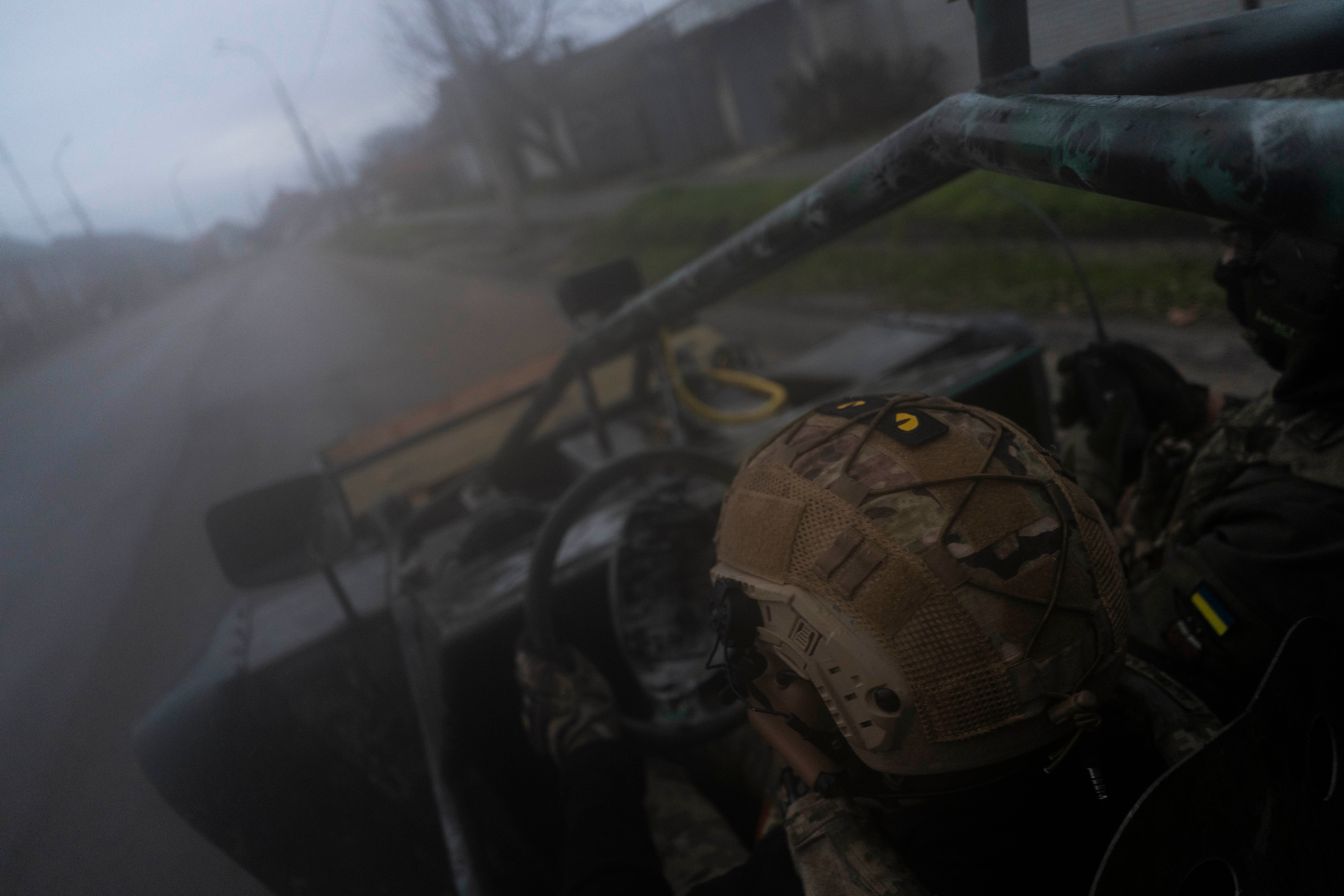 Ukrainian servicemen drive towards the frontline in Kherson, southern Ukraine on 23 November