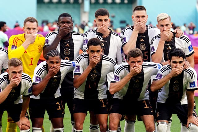 Germany players cover their mouths (Mike Egerton/PA)