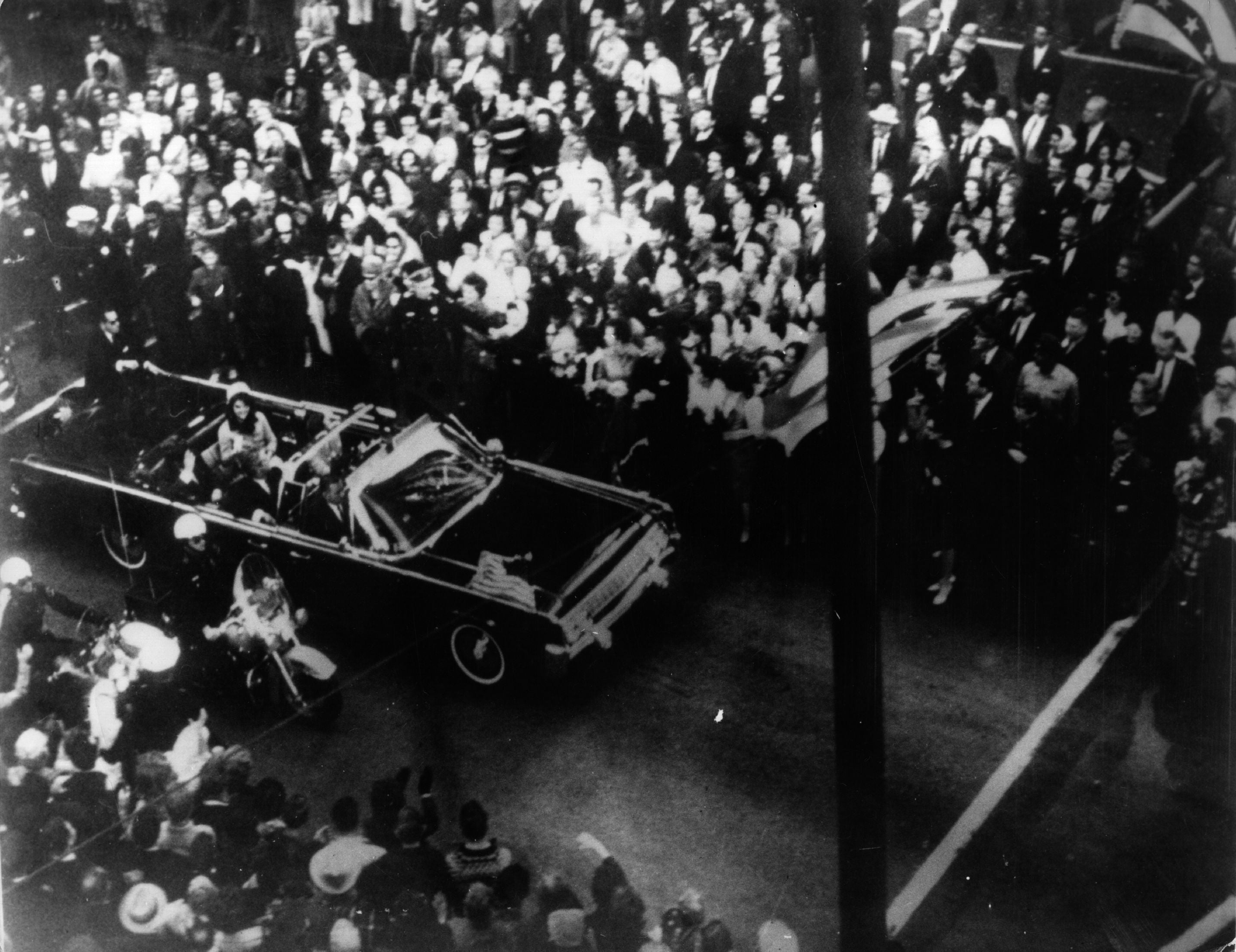 John F Kennedy, 35th president of the US, and first lady Jacqueline Kennedy traveling in the presidential motorcade in Dallas, shortly before his assassination