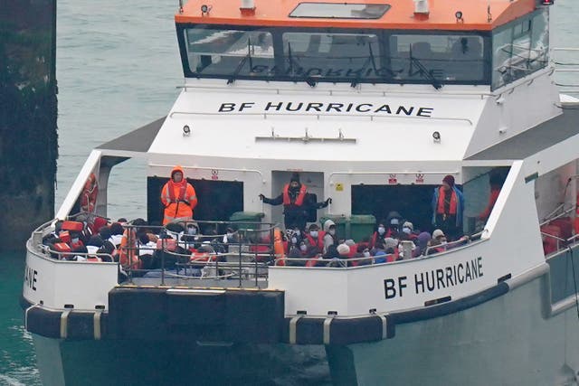 A group of people thought to be migrants are brought in to Dover onboard a Border Force vessel following a small boat incident in the Channel. (Gareth Fuller/PA)