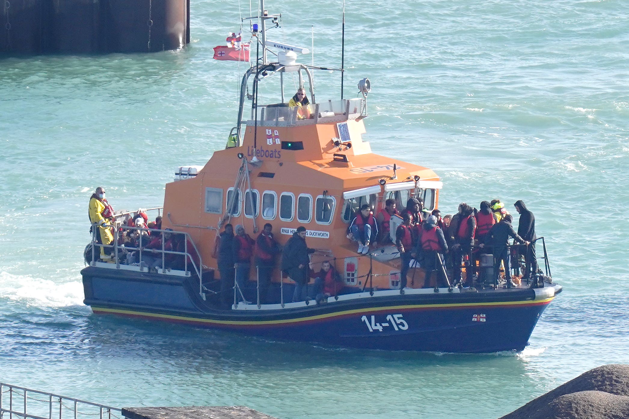A group of people thought to be migrants are brought into Dover (Gareth Fuller/PA)
