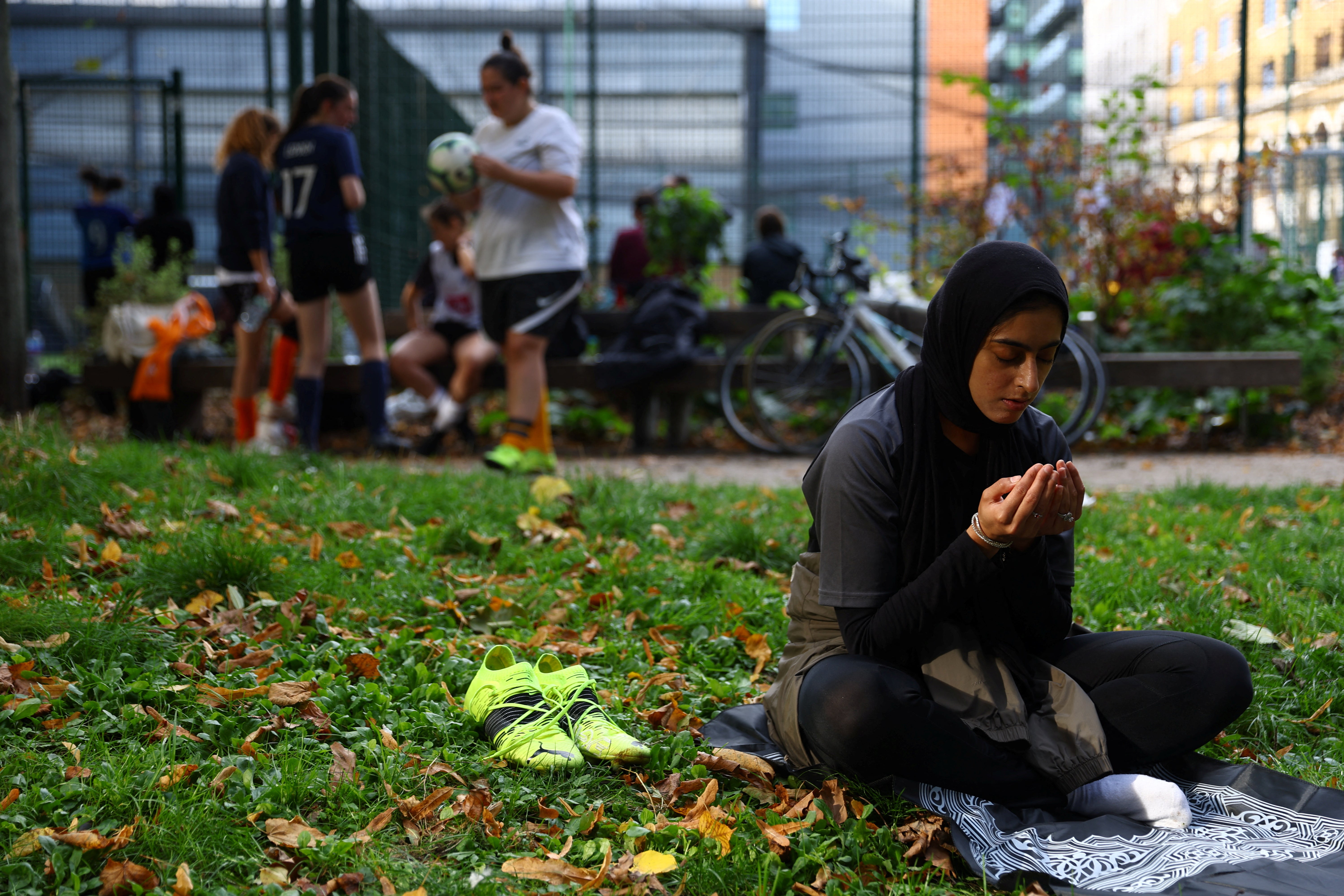 Fatima Ali, 26, prays between matches during the Ladies Super Liga 5-a-side tournament at The Colombo Centre