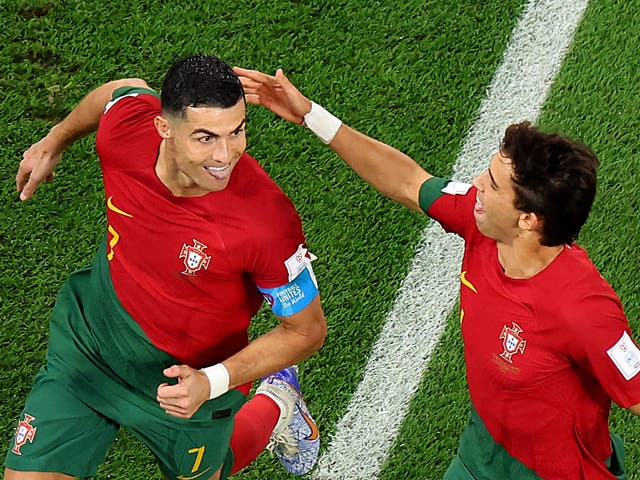 <p>Cristiano Ronaldo of Portugal celebrates with Joao Felix</p>