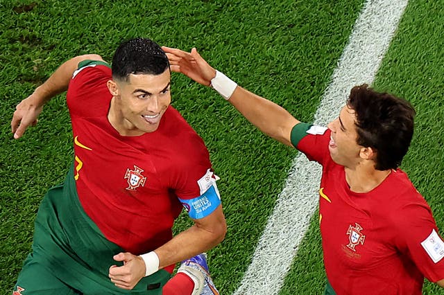 <p>Cristiano Ronaldo of Portugal celebrates with Joao Felix</p>