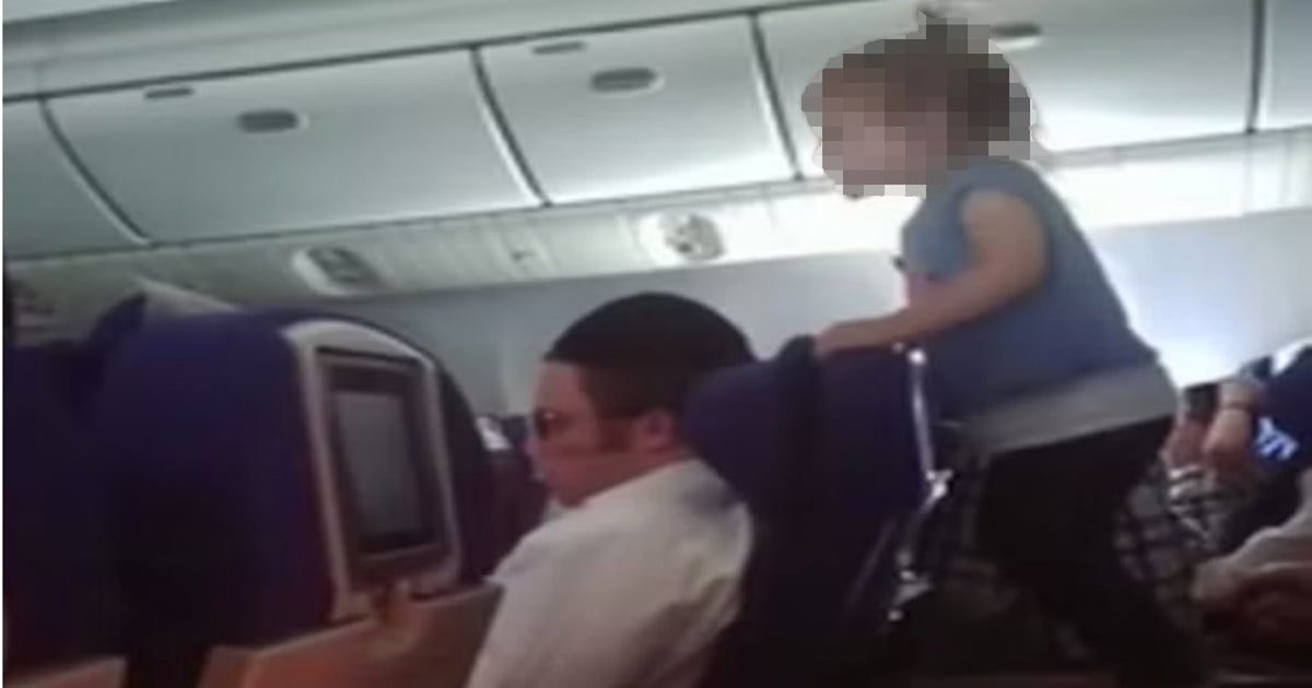 Parents under fire after child filmed 'running wild' on flight | The  Independent