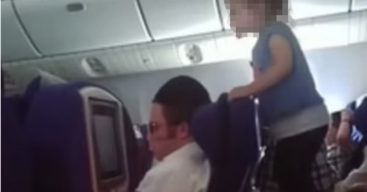 Parents under fire after child filmed 'running wild' on flight | The Independent