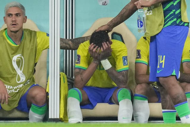 Neymar looks dejected on the bench after suffering an ankle injury (Peter Byrne/PA)