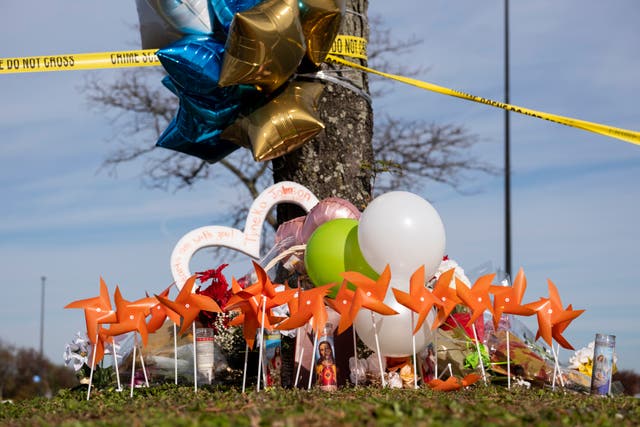 <p>A memorial is set up outside of the Chesapeake, Va., Walmart on Thursday, 24 November 2022.  Andre Bing, a Walmart manager, opened fire on fellow employees in the break room of the Virginia store, killing six people in the country’s second high-profile mass shooting in four days, police and witnesses said Wednesday</p>