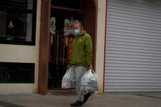 Panic-buying in Beijing as city adds new quarantine centers