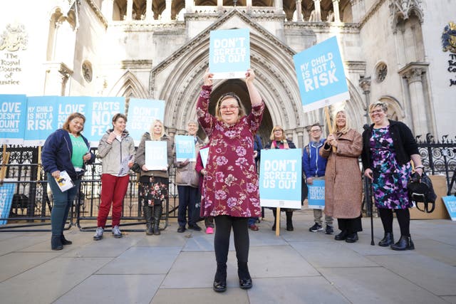 <p>Supporters of Heidi Crowter and Maire Lea-Wilson outside the Royal Courts of Justice in central London</p>