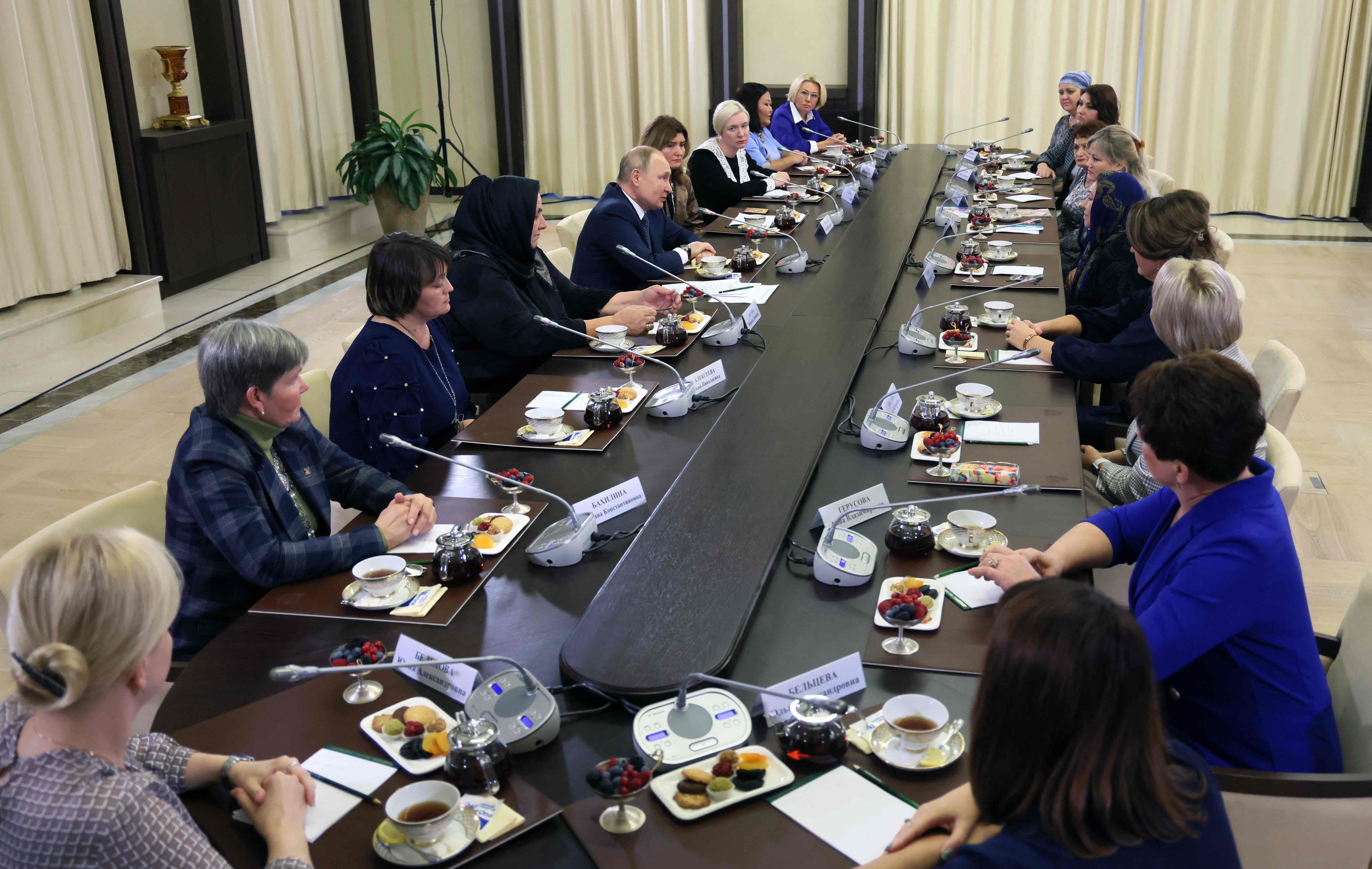 Vladimir Putin participates in a meeting with mothers of Russia's servicemen