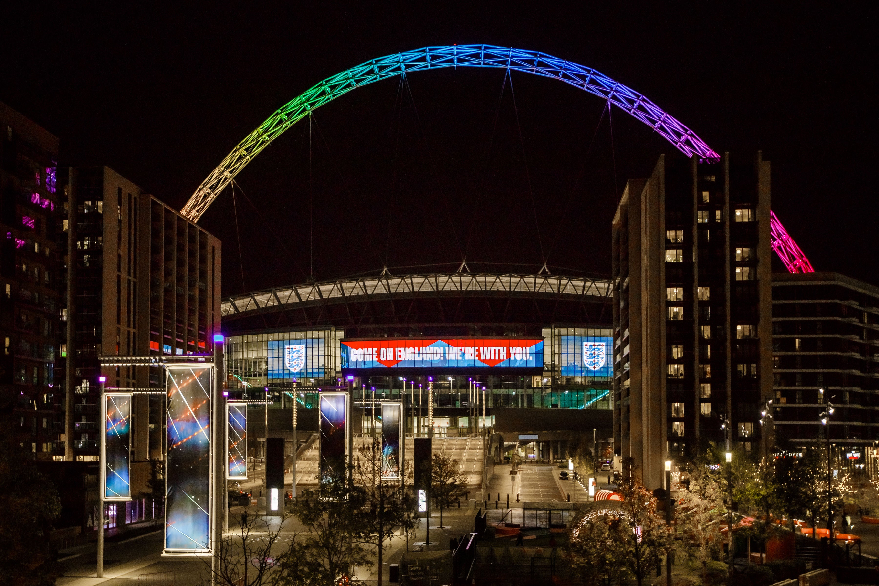 The Wembley arch lit up over the stadium