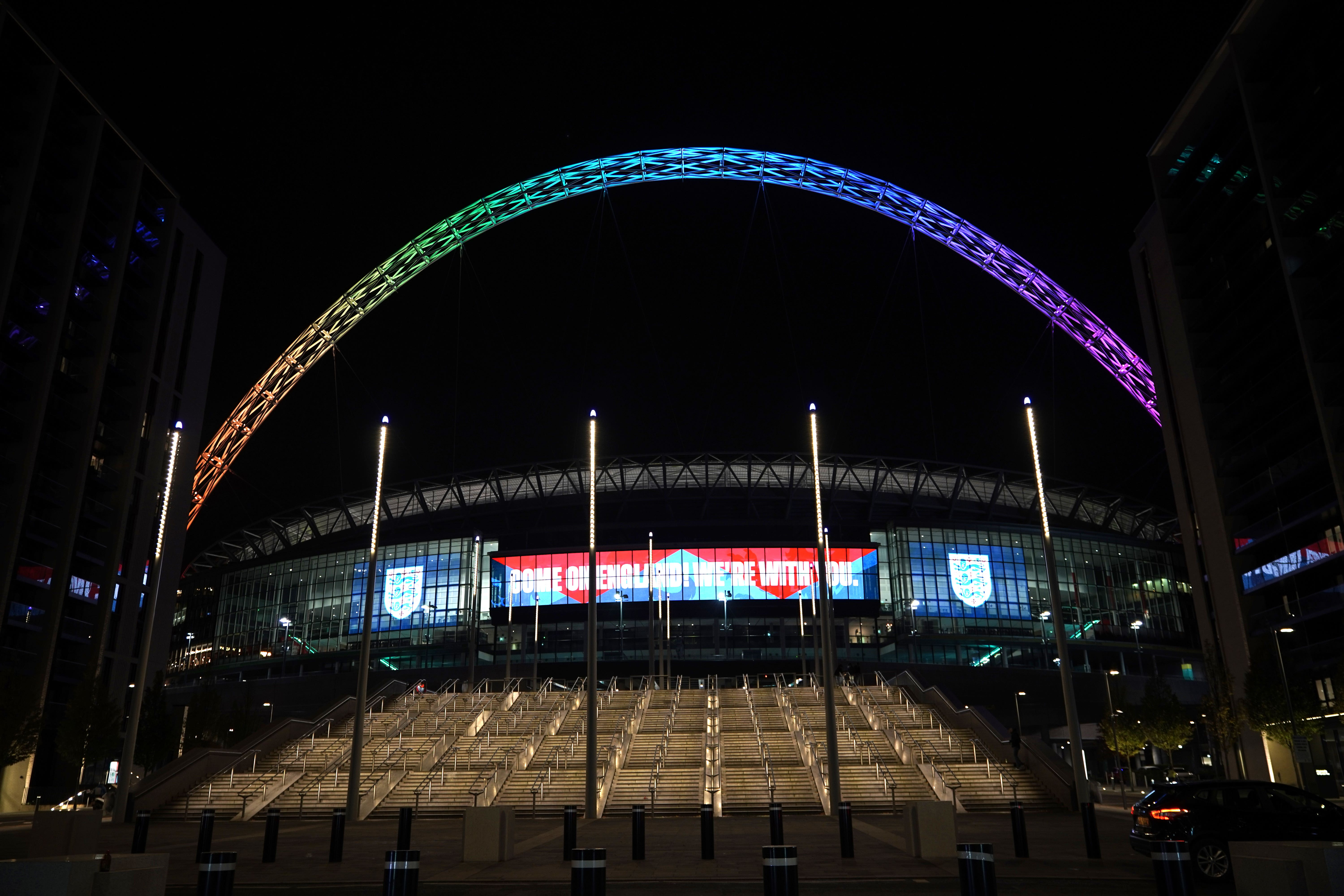 Wembley Stadium’s arch is lit up in rainbow colours while England play the USA in Qatar (Yui Mok/PA)