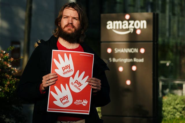 <p>Activist Dylan Murphy outside Amazon’s European headquarters in Dublin</p>