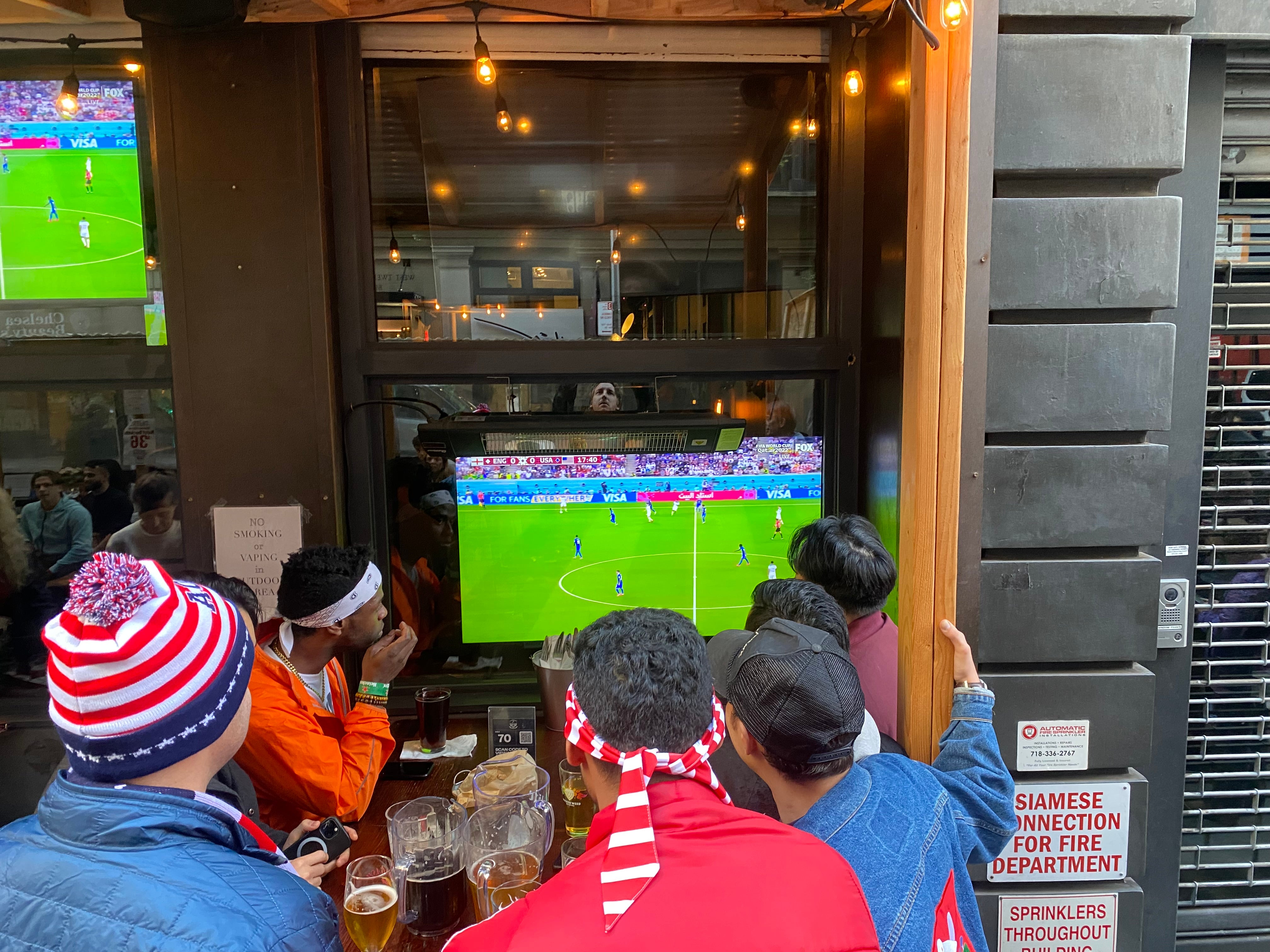 Football fans watch England vs USA at a New York bar in the group stage of the 2022 World Cup