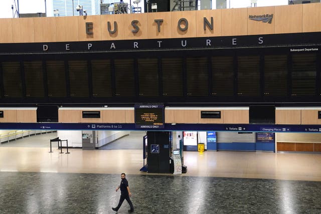 <p>Empty departures board at Euston station in London</p>