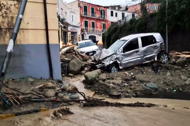 <p>Destroyed cars are pictured in Casamicciola after heavy rains caused a landslide</p>